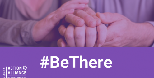 Two people holding hands with words '#BeThere'